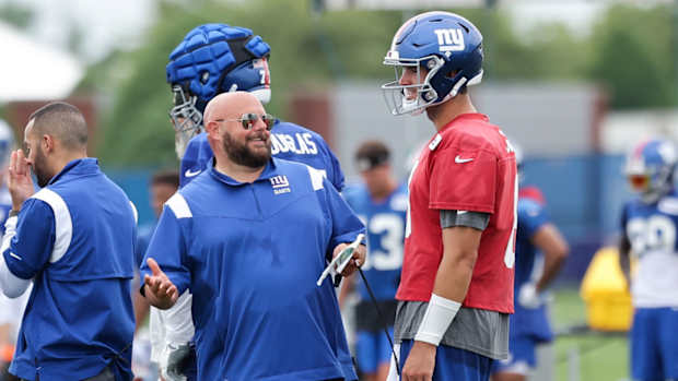 Jul 29, 2022; East Rutherford, NJ, USA; New York Giants head coach Brian Daboll talks to quarterback Daniel Jones (8) during training camp at Quest Diagnostics Training Facility.